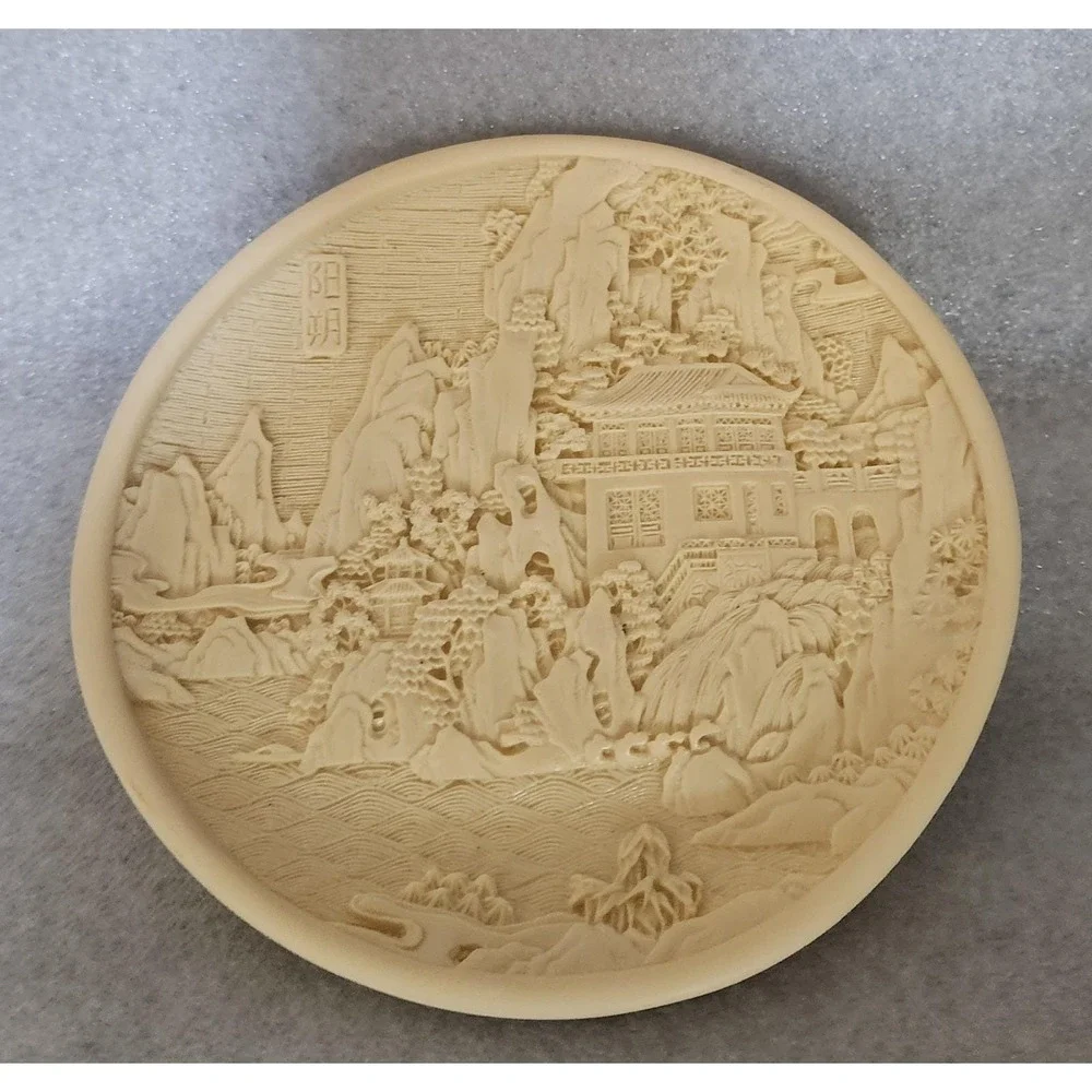 Vintage Chinese carved resin decorative plate with a landscape motif